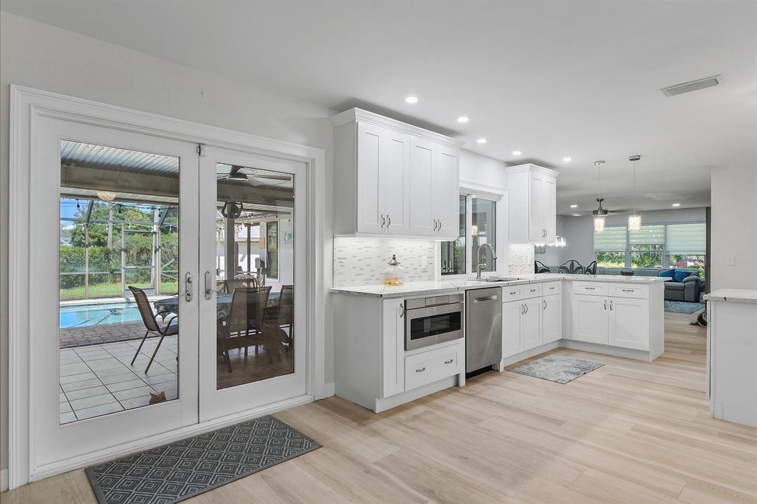 Kitchen opens to Screened Pool