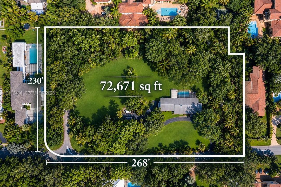 Expansive 72,671 square foot lot featuring a private swimming pool, mature trees, manicured lawn, and a circular driveway