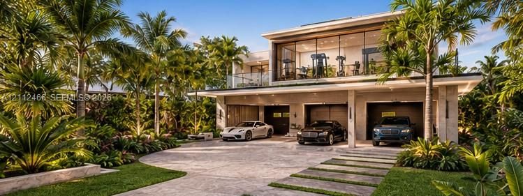 Modern exterior featuring a three-car garage, floor-to-ceiling glass windows, a glass-panel balcony railing, and natural stone paver driveway with integrated landscape accents