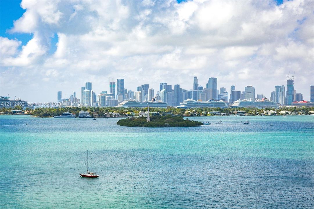Direct waterfront exposure featuring open water access, maritime activity, and a panoramic skyline backdrop
