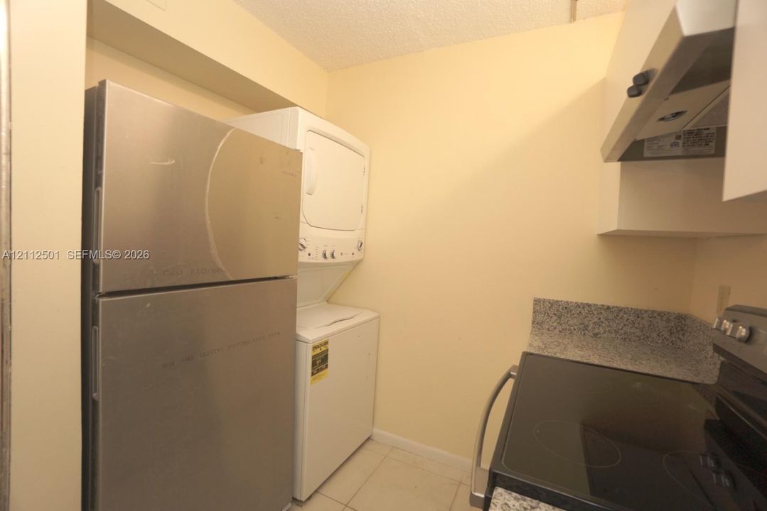 Ceramic tile flooring throughout with wall-mounted wire shelving units