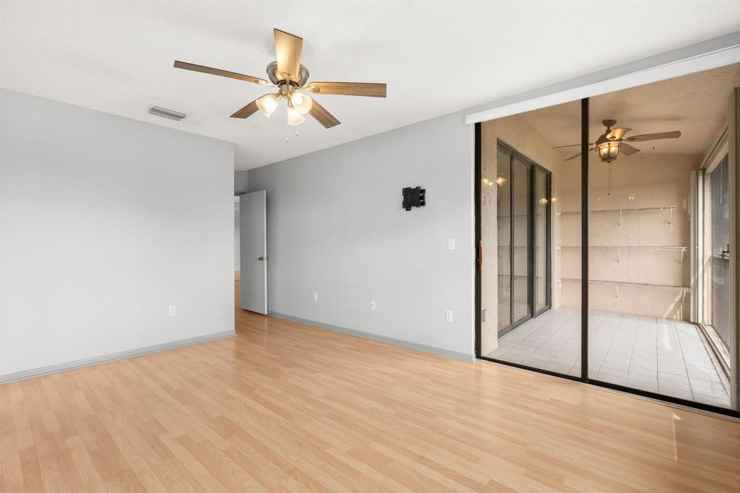PRIMARY BEDROOM WITH ACCESS TO BALCONY
