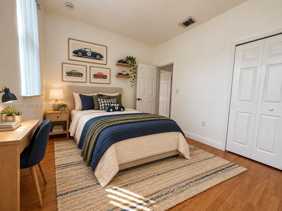 Wood-finish flooring, tall vertical window, and dual-panel closet doors