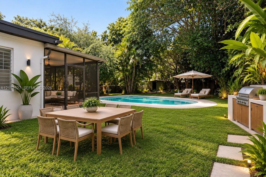 Screened patio, swimming pool with concrete surround, built-in outdoor kitchen with stainless steel grill, and manicured lawn