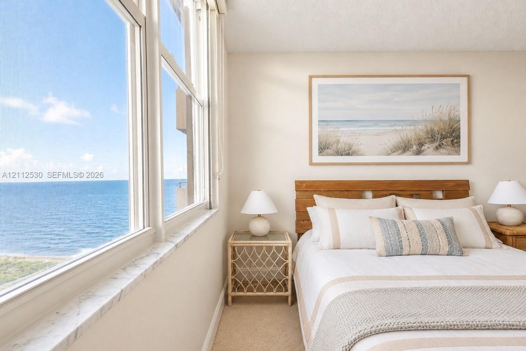 Floor-to-ceiling windows featuring stone sills and expansive ocean scenery