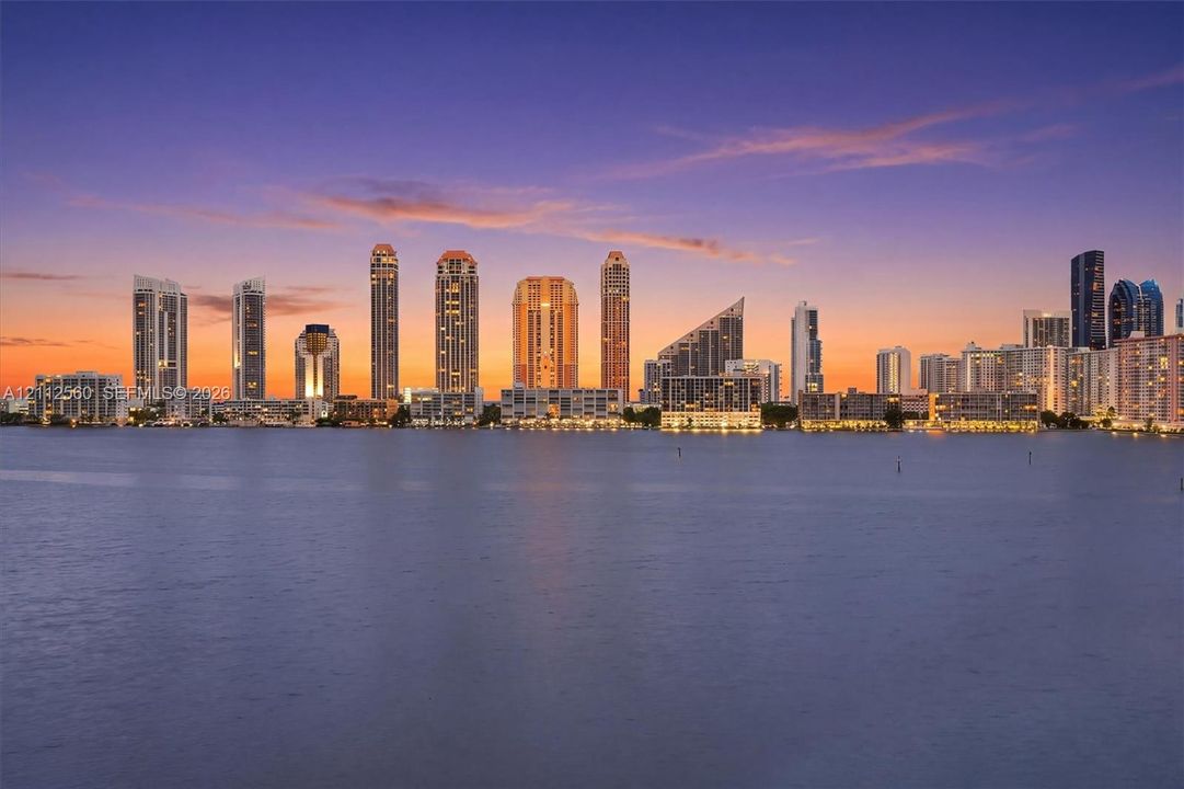 Waterfront location featuring expansive skyline scenery at sunset