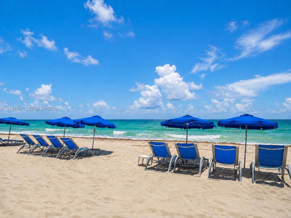 Direct beachfront access with expansive sandy shoreline and ocean waters
