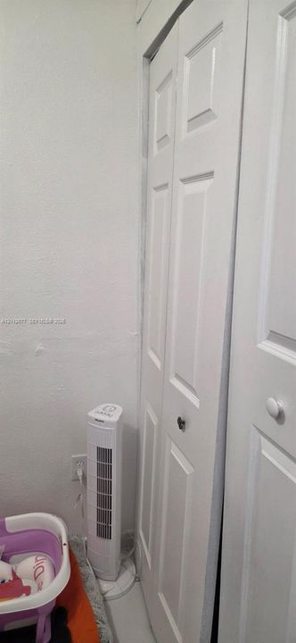 White bi-fold closet doors with round hardware