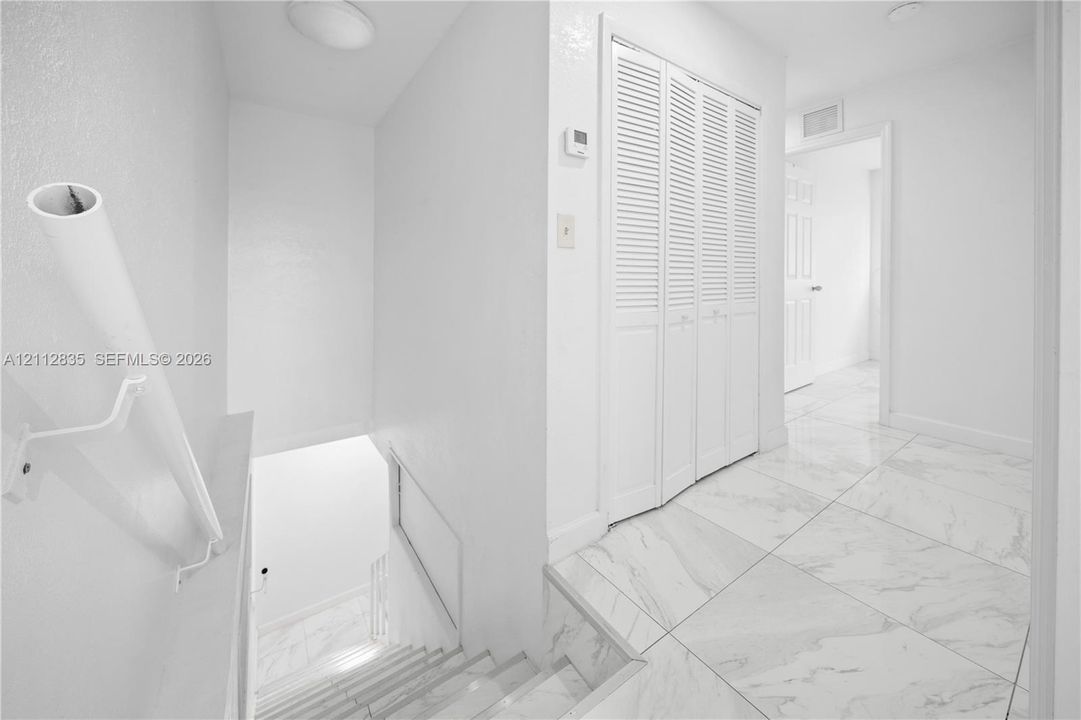 Interior hallway connecting the home's living spaces.
