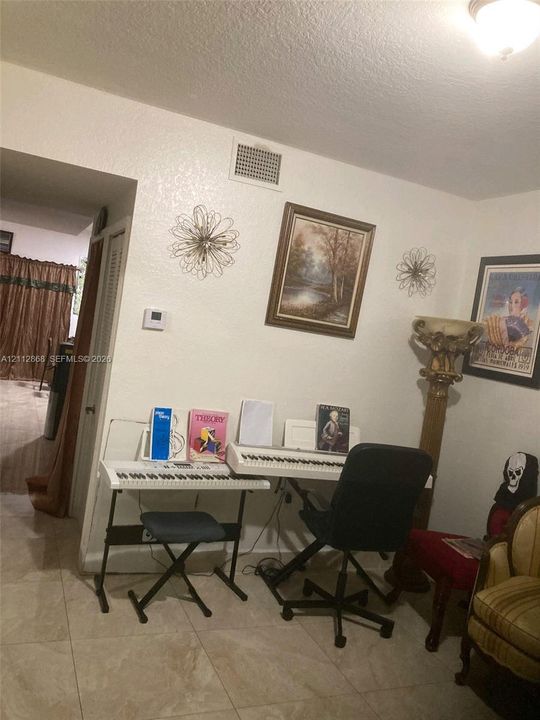 Neutral-tone ceramic tile flooring and ceiling-mounted dome lighting