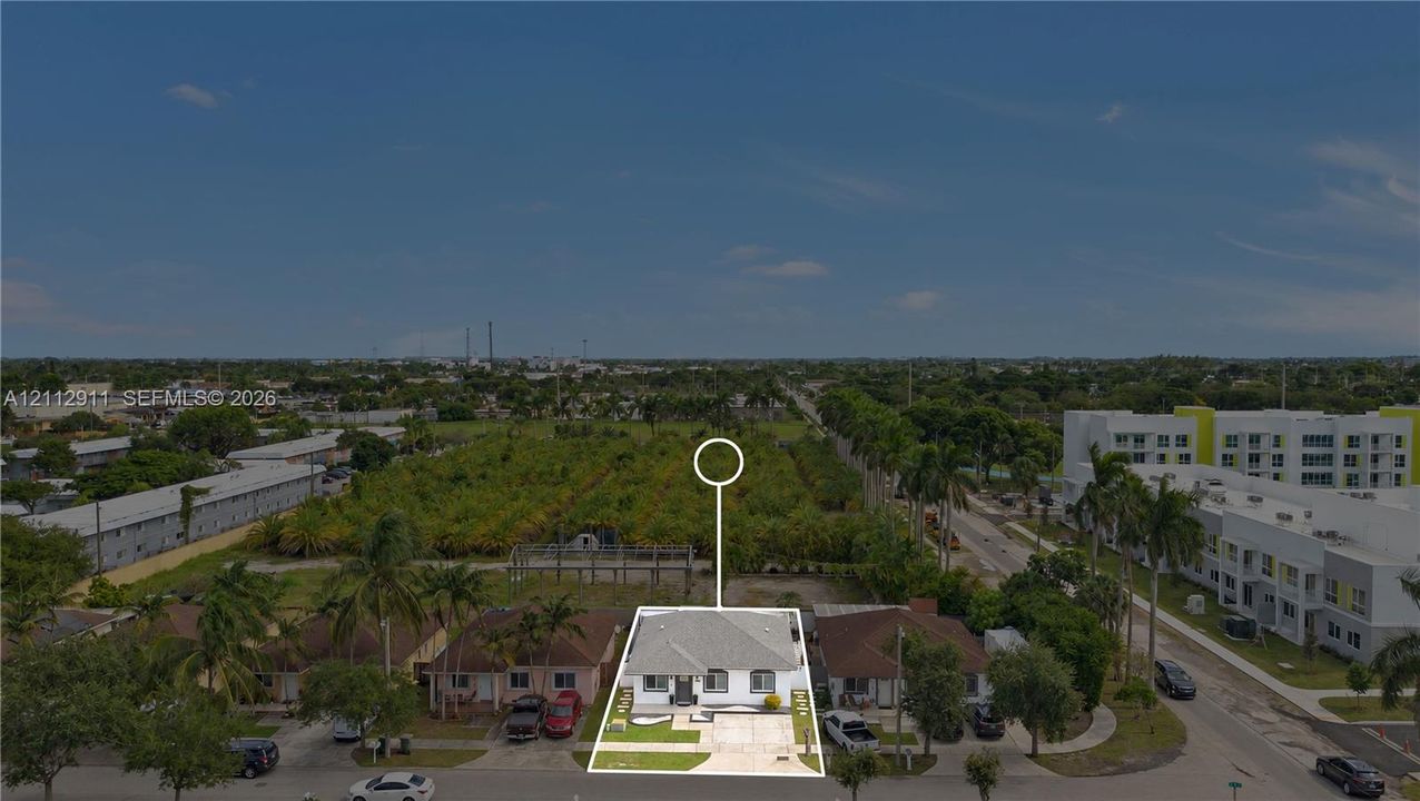 Single-story residence featuring a hip roof, concrete driveway, and front lawn