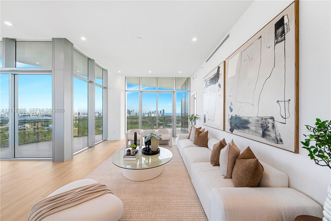 Floor-to-ceiling windows, wood-finish flooring, recessed lighting, and expansive glass sliding doors