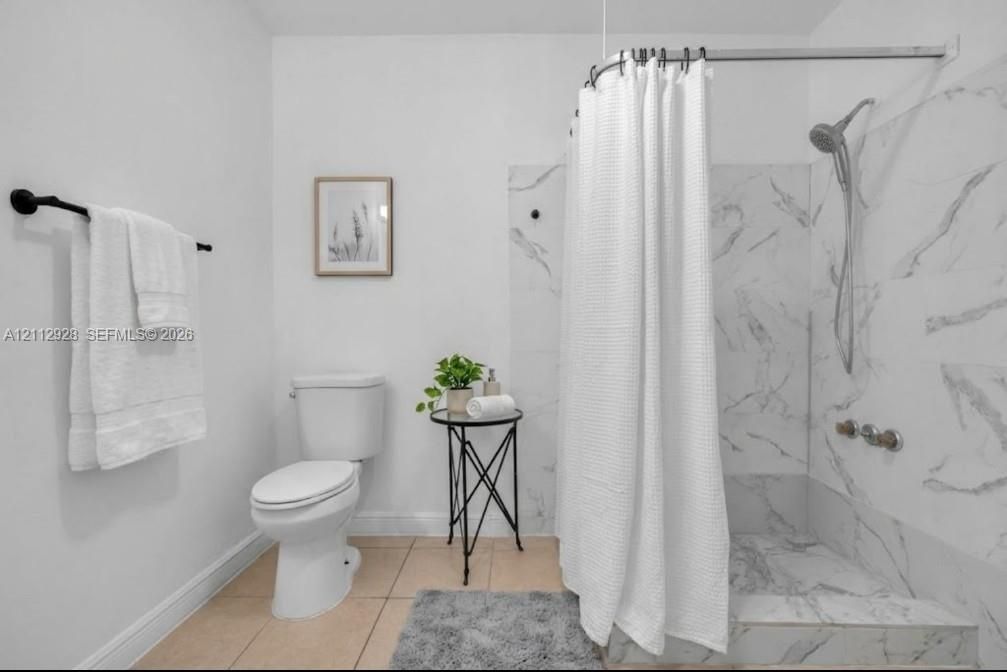 Virtually staged (AI). Furniture and decor are not real. The unaltered original is the previous photo.