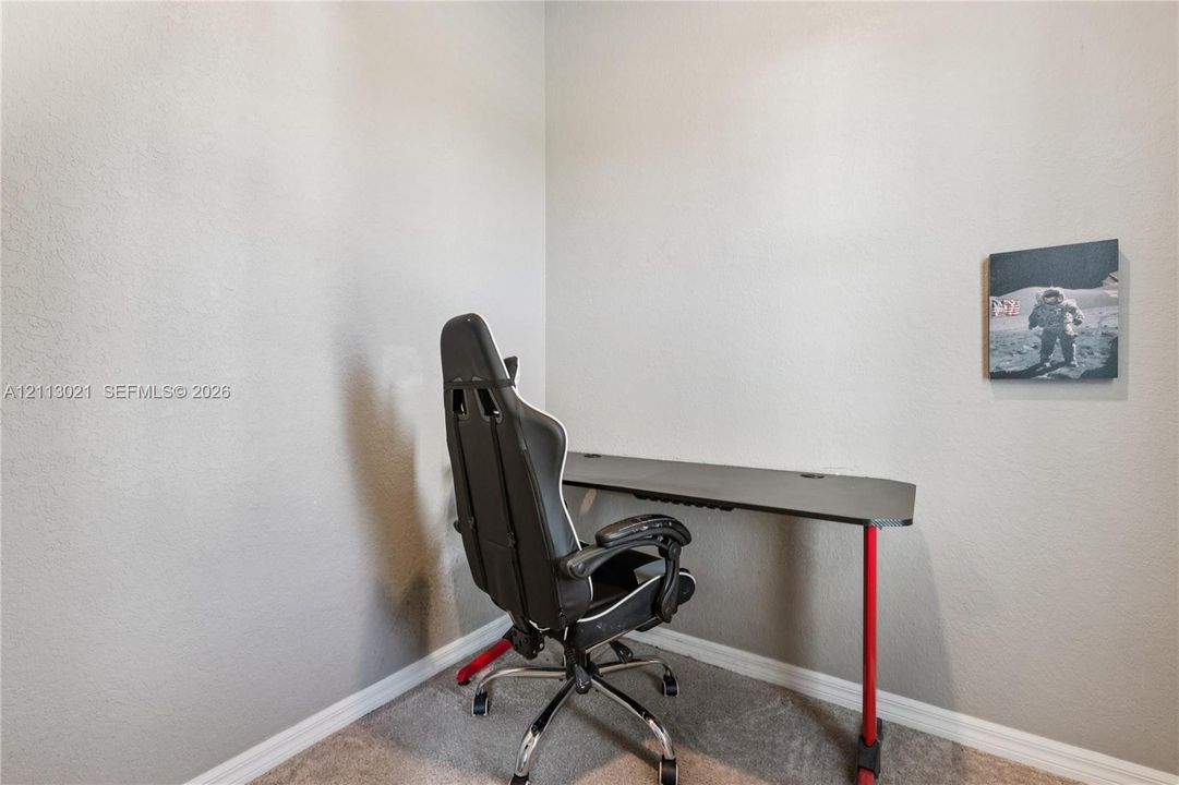 Neutral-toned wall finish with high-pile carpeting