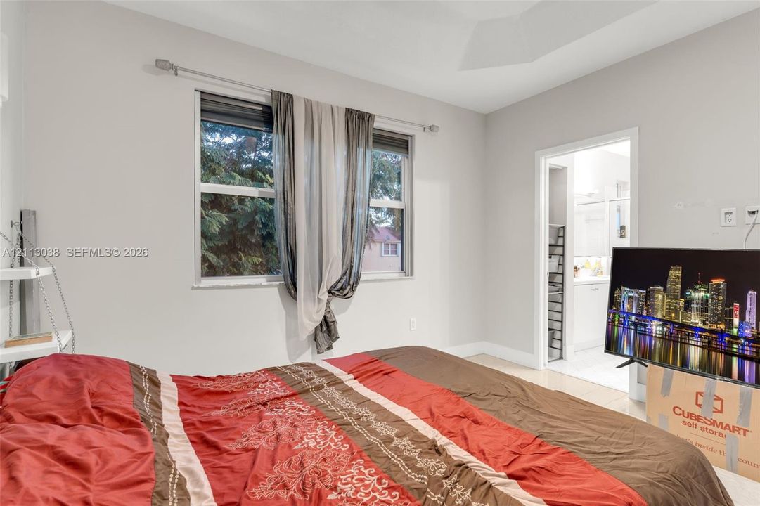 Tray ceiling with neutral wall paint and multi-pane window