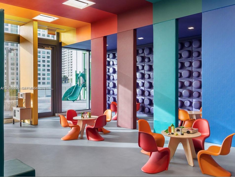 Multicolor interior featuring floor-to-ceiling structural pillars, recessed ceiling lighting, glass door access, and textured wall paneling
