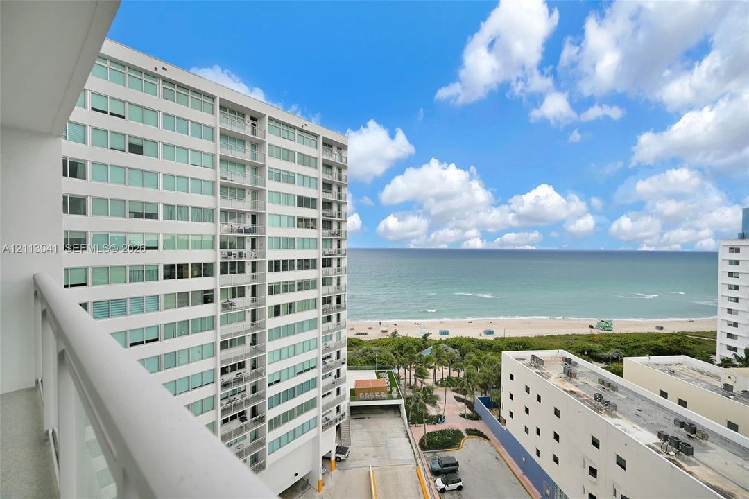 High-rise balcony featuring metal railings and direct oceanfront scenery