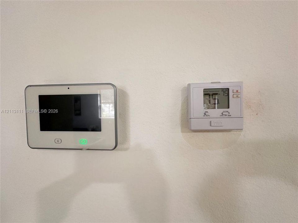 Wall-mounted digital security system console and programmable HVAC thermostat