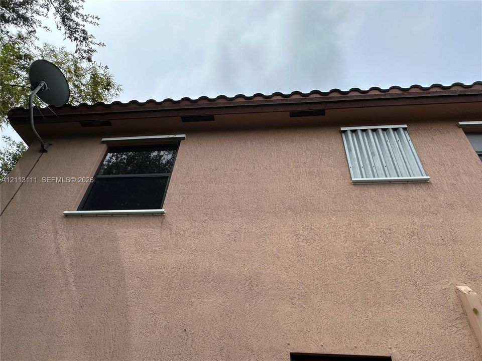 Hurricane  Shutters  installed corrugated metal hurricane shutters