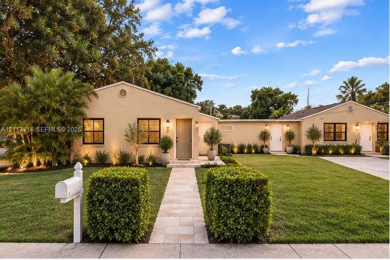 AI-generated photo of the single-story residence featuring light-toned stucco exterior, stone paver walkway, manicured lawn, dark-framed windows, and integrated wall-mounted lighting