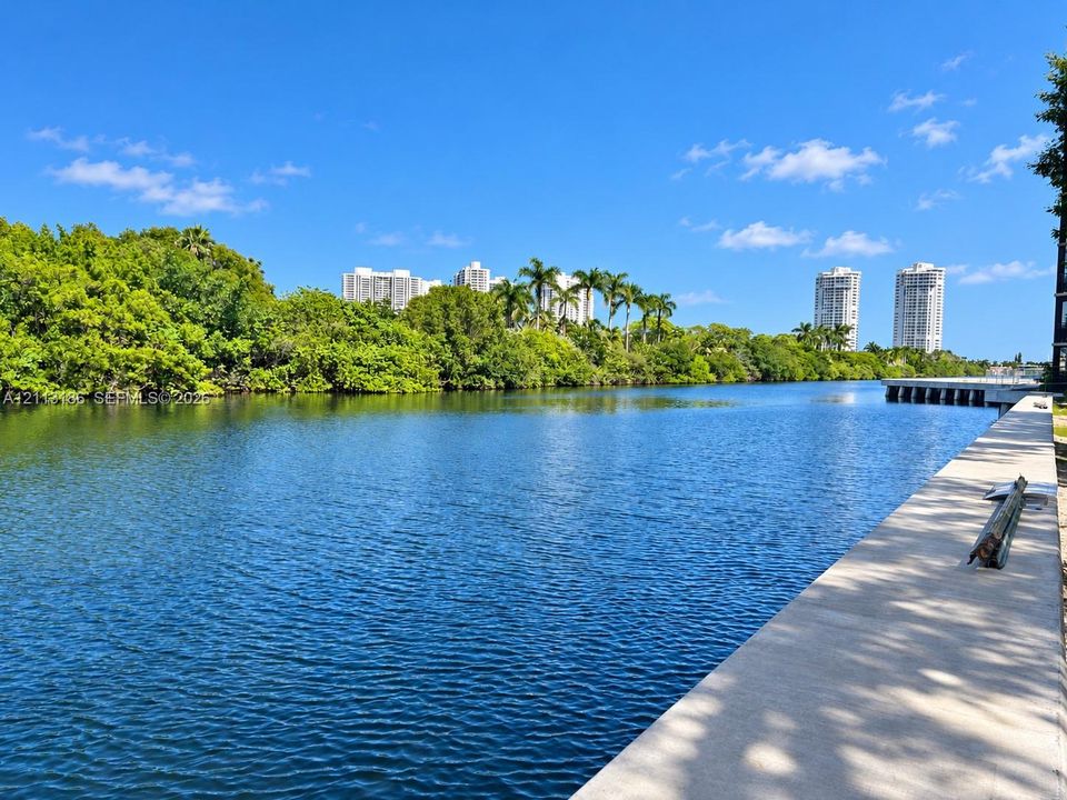 Waterfront property featuring a concrete bulkhead and native shoreline landscaping