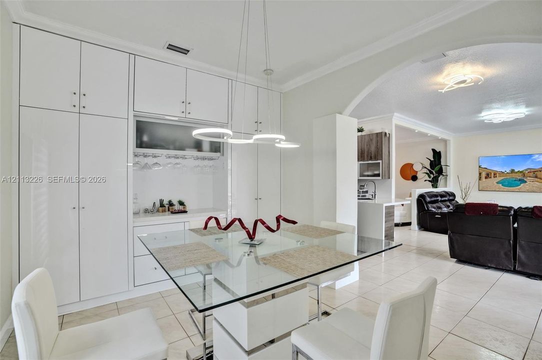 Floor-to-ceiling built-in cabinetry with integrated storage and tile flooring