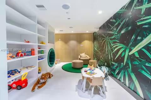 Built-in white shelving, integrated circular wall accent, wood-paneled feature wall, and botanical-patterned wallpaper