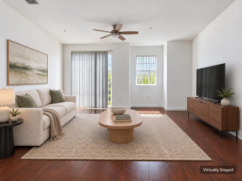Virtually staged sage-accented living ro