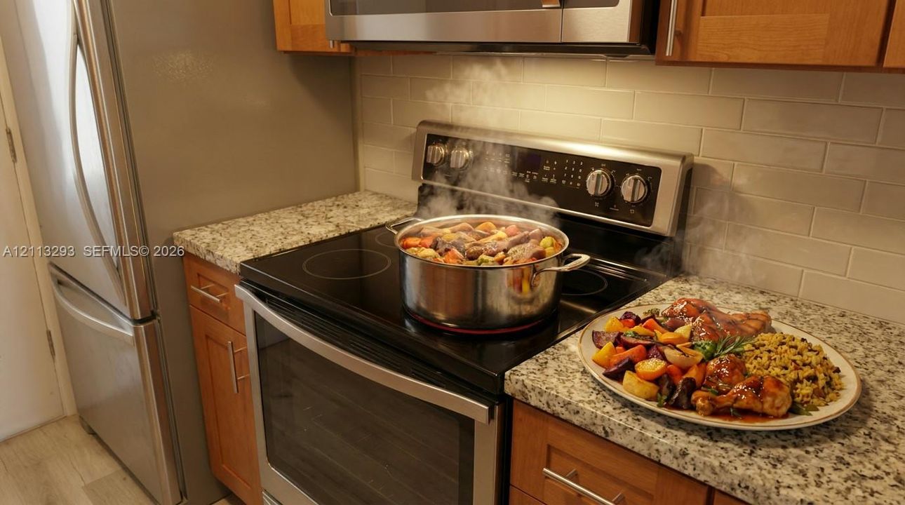 Kitchen featuring wood cabinetry, stone-finish countertops, subway tile backsplash, and stainless steel appliances