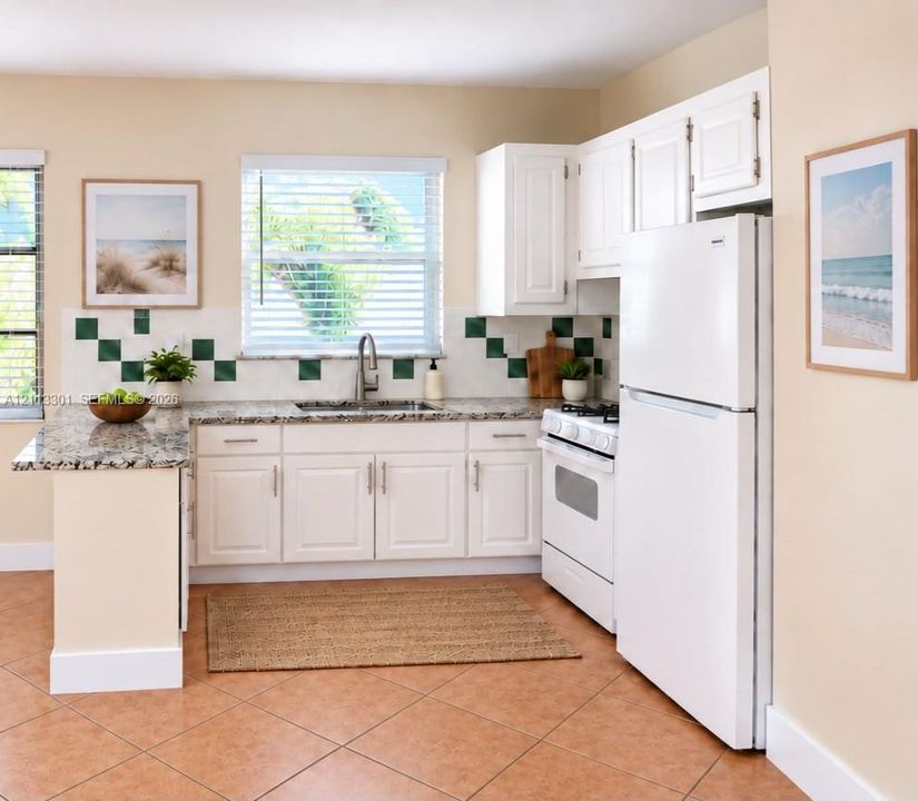 Kitchen featuring white shaker-style cabinetry, stone-finish countertops, decorative tile backsplash, stainless steel sink with pull-down faucet, and neutral tile flooring