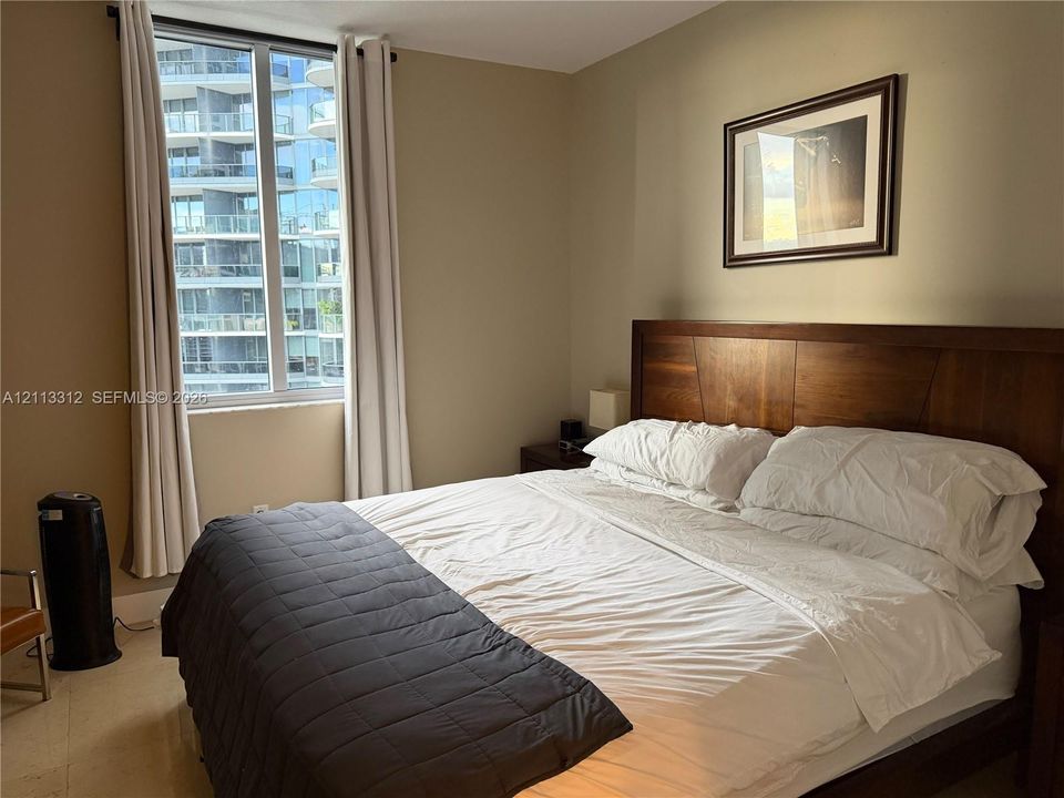 Large window featuring neutral-toned walls and hard-surface flooring