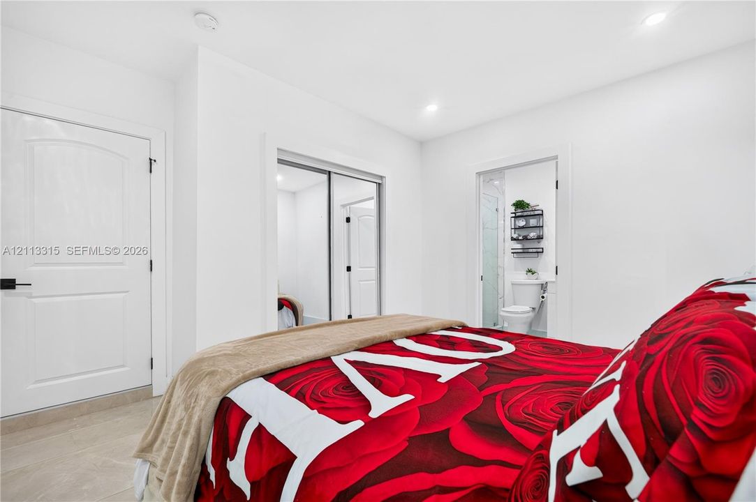 Interior featuring neutral wall coloring, recessed lighting, mirrored sliding closet doors, and hard-surface flooring
