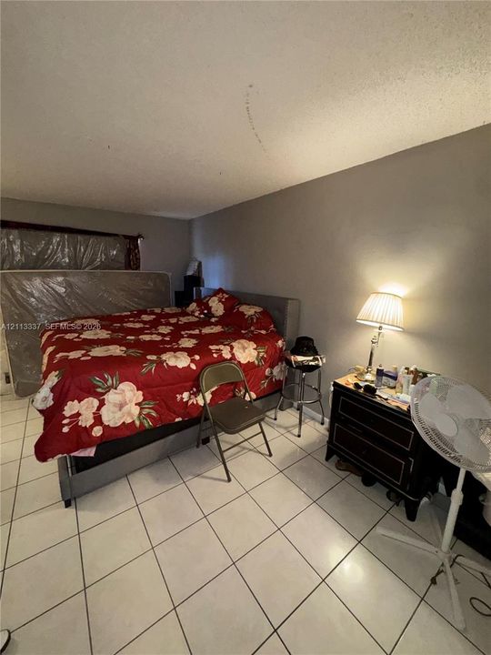 Room featuring light-colored ceramic tile flooring and neutral wall paint