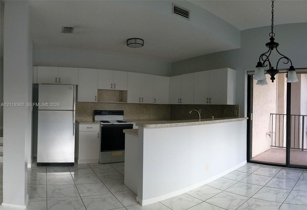 Kitchen with breakfast bar.