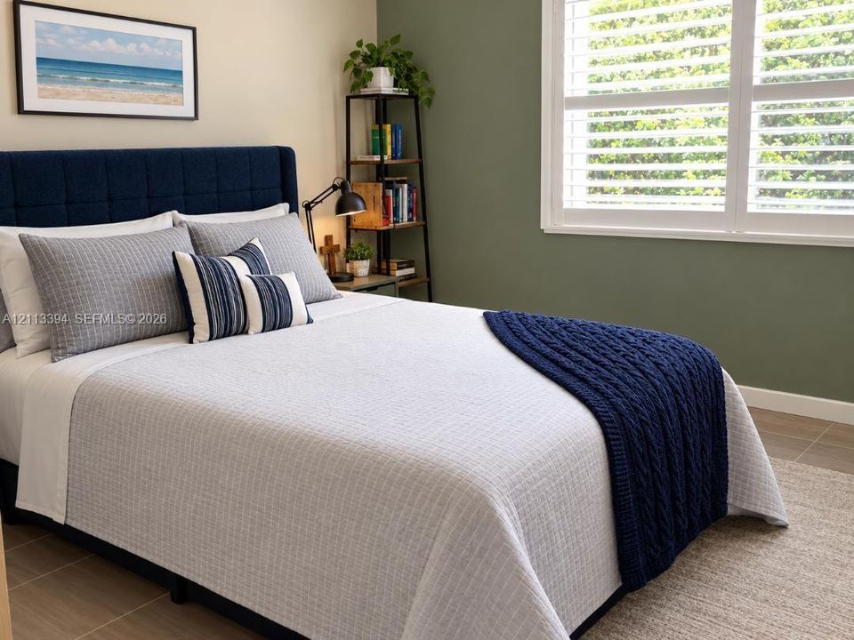 Dual-tone wall finishes featuring a sage green accent wall, white plantation shutters, and large-format tile flooring