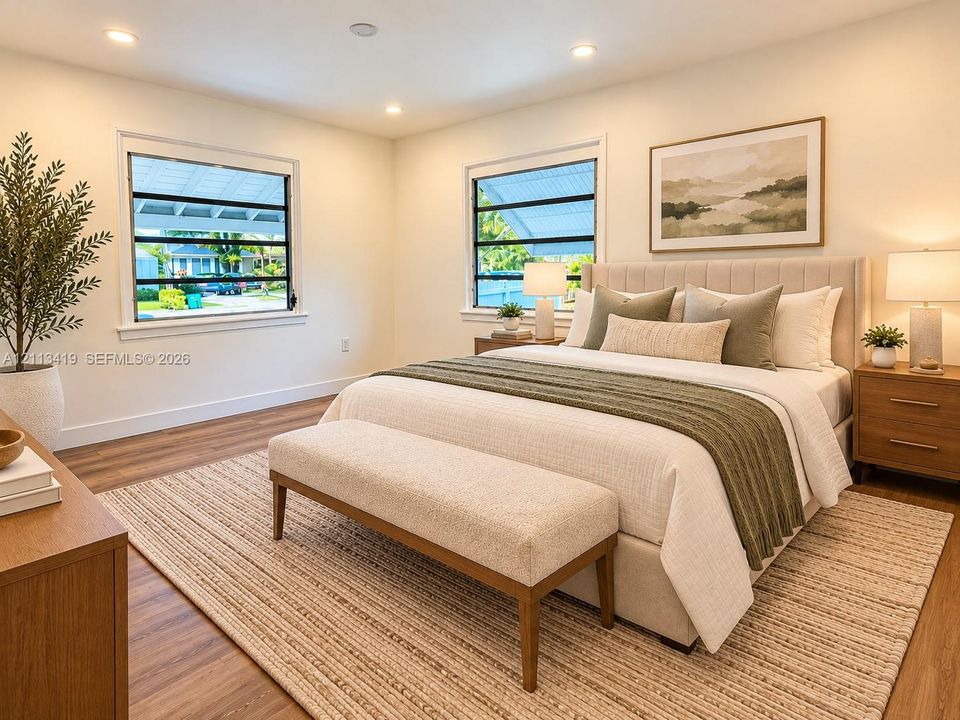 Virtually staged neutral-toned room featuring wood-finish flooring, recessed lighting, and dual horizontal louvered windows