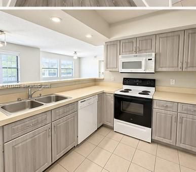 Kitchen featuring wood-finish cabinetry, neutral solid-surface countertops, recessed lighting, and tile flooring
