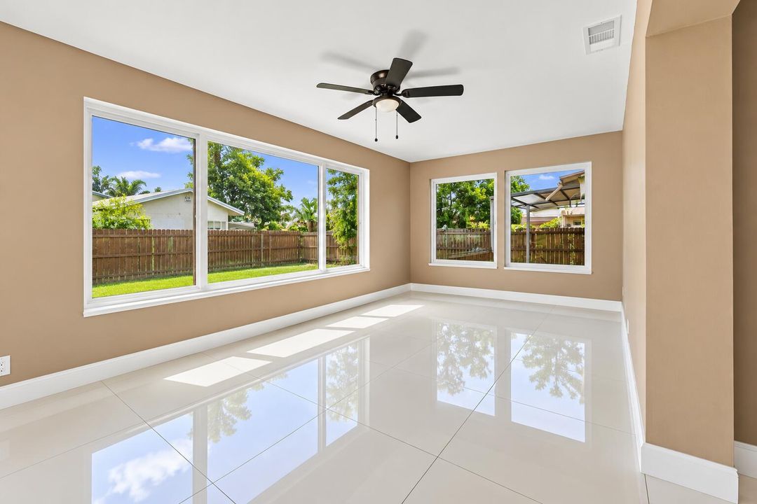 Sunlit Empty Room with Glossy Floors