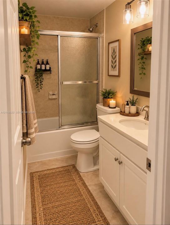 White vanity cabinet featuring a solid surface countertop with an integrated oval sink, chrome finish faucet, framed wall-mounted mirror, brushed-finish double-light fixture, and a sliding glass door shower enclosure