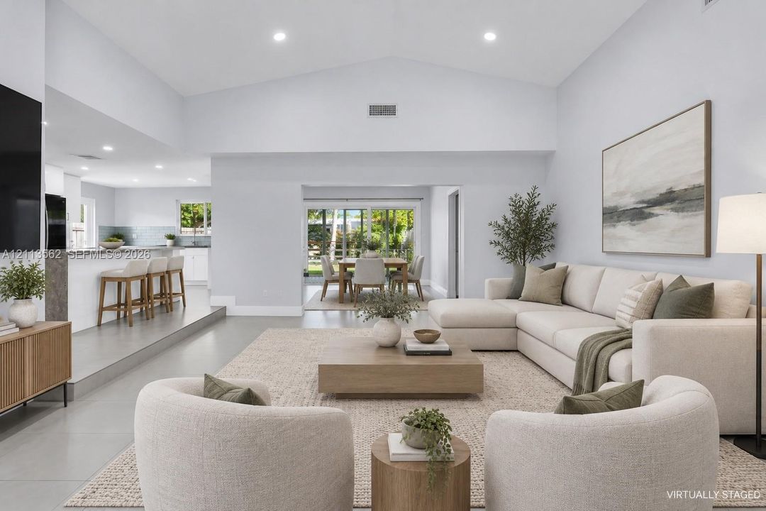 Vaulted ceilings, recessed lighting, and large-format flooring