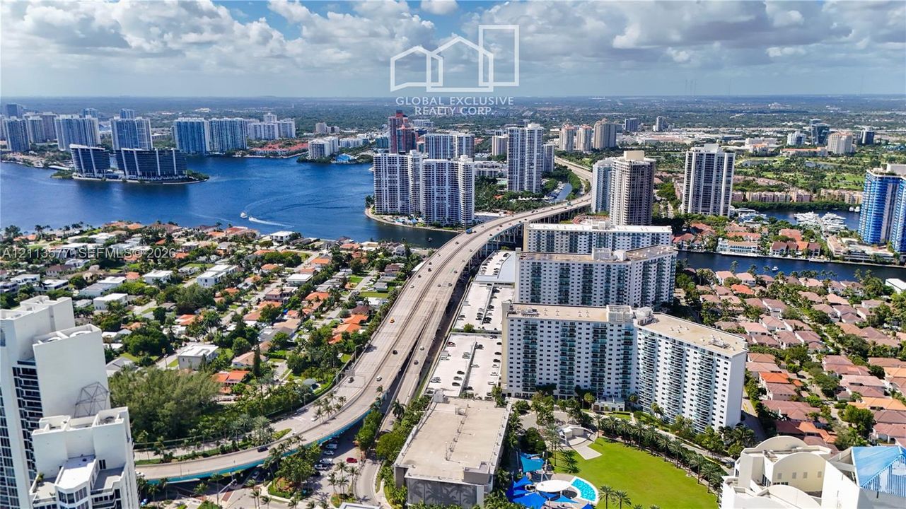 Aerial perspective showcasing waterfront access, proximity to major thoroughfares, and surrounding high-rise infrastructure