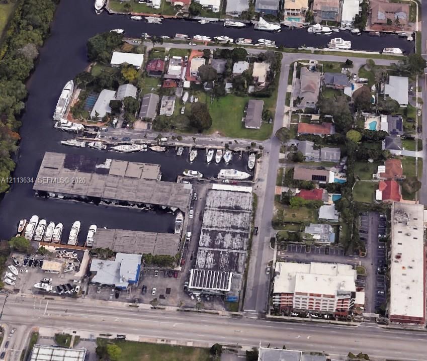 Waterfront property featuring extensive canal frontage, deep-water boat slips, covered docking structures, and direct maritime access