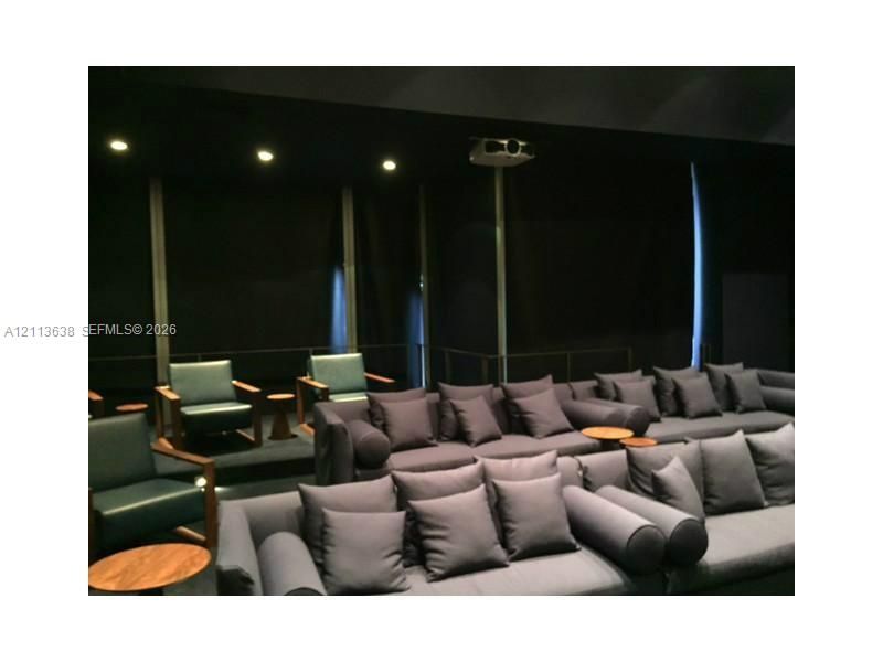 Tiered flooring, recessed lighting, and a mounted ceiling projector