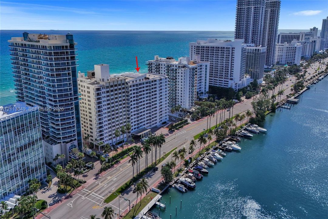 High-rise residential building featuring immediate proximity to the coastline, waterfront positioning, and panoramic ocean surroundings
