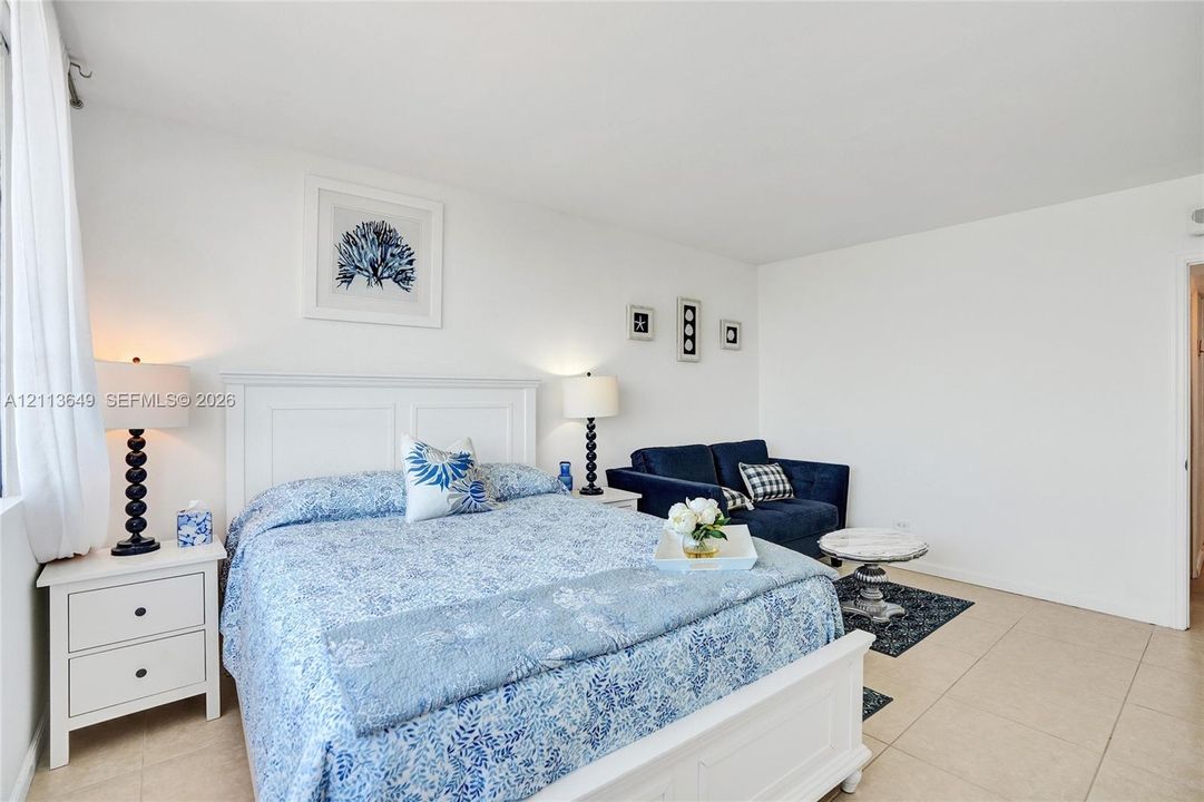 Neutral-toned interior space with light-colored tile flooring and crisp white wall finishes