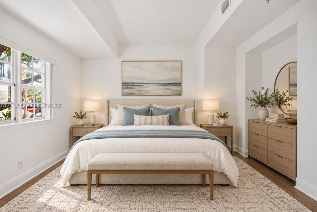High ceilings with recessed lighting, multi-pane windows, recessed wall niche, and wood-finish flooring