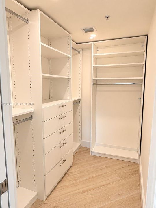 primary bedroom walk-in closet