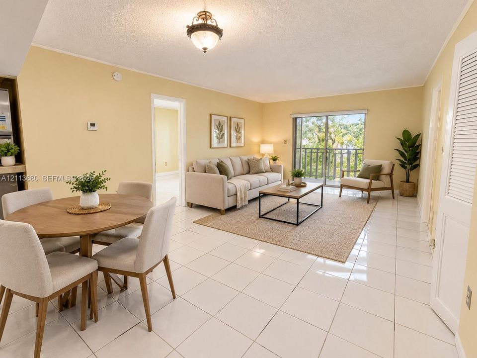 Open living area featuring large-format ceramic floor tiles, glass sliding doors, and a decorative semi-flush mount ceiling fixture