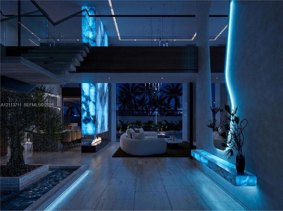 Open-concept interior featuring large-format stone flooring, back-lit stone column, linear fireplace, and integrated LED wall accent