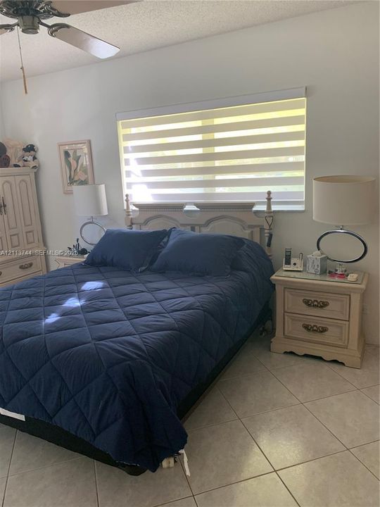 Ceramic tile flooring, horizontal dual-layer shade, and ceiling fan with integrated light fixture